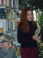 Aliye reads from her book with Yaşar Ersoy listening